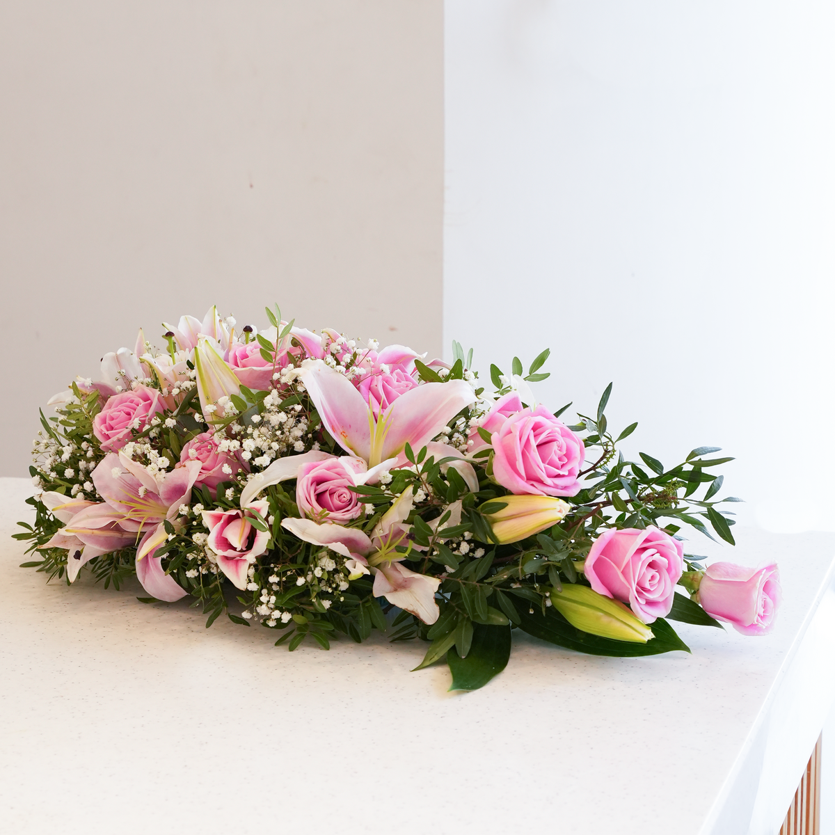 
              Pink Roses and Pink Lily Funeral Spray