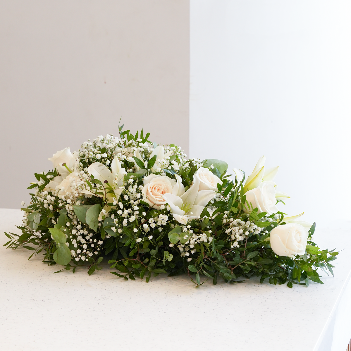 
              White Roses and White Lily Funeral Spray